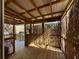 View of wood deck covered patio featuring decorative accents, rustic privacy and beams at 1395 W Booth Road Sw Ext, Marietta, GA 30008