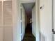 Hallway featuring new floors and doors, with a closet in view at 1395 W Booth Road Sw Ext, Marietta, GA 30008