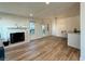 Open living area with wood floors, a fireplace, and a view into the bar with seating at 1395 W Booth Road Sw Ext, Marietta, GA 30008