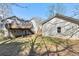 Backyard view of home with a deck and trees in the background at 158 Ashwood Drive Dr, Dallas, GA 30157