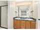 Bathroom showcasing a double sink vanity with wooden cabinets and a glass door shower at 158 Ashwood Drive Dr, Dallas, GA 30157