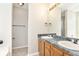 Bathroom features a double sink vanity with granite countertop and tile floor leading to a shower stall at 158 Ashwood Drive Dr, Dallas, GA 30157