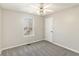 Bedroom with a ceiling fan, window, and carpeted floor at 158 Ashwood Drive Dr, Dallas, GA 30157