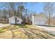 Two-story home features vinyl siding, two-car garage, a back deck, and driveway at 158 Ashwood Drive Dr, Dallas, GA 30157