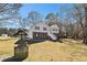 Two-story home exterior with brick facade and a well in the yard at 158 Ashwood Drive Dr, Dallas, GA 30157