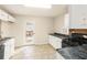 Functional kitchen featuring white cabinets, black appliances, and a door to the outside at 158 Ashwood Drive Dr, Dallas, GA 30157