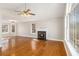 Spacious living room with a fireplace, large windows, and hardwood floors at 158 Ashwood Drive Dr, Dallas, GA 30157