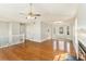 Bright living room featuring hardwood floors, fireplace, ceiling fan and natural light at 158 Ashwood Drive Dr, Dallas, GA 30157