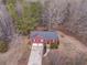 Directly overhead aerial view of home with a long driveway and wooded surroundings at 60 Kyler Way Way, Dallas, GA 30157