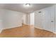 Basement space with laminate flooring, several doors, and ample potential for customization at 60 Kyler Way Way, Dallas, GA 30157