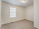 Bedroom featuring a window, neutral carpet, baseboards, white walls and ceiling at 60 Kyler Way Way, Dallas, GA 30157