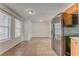 Bright dining room featuring tiled flooring, black refrigerator and natural lighting at 60 Kyler Way Way, Dallas, GA 30157