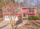 Two-story home with a two-car garage and mature landscaping at 60 Kyler Way Way, Dallas, GA 30157