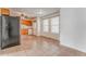 Kitchen and dining area showcasing stainless steel appliances, wood cabinets, and tiled floors at 60 Kyler Way Way, Dallas, GA 30157