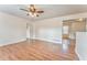 Open-concept living room with neutral walls and wood laminate flooring at 60 Kyler Way Way, Dallas, GA 30157