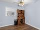 Bright dining area features wood floors, a ceiling fan, and a stylish hutch for storage and display at 1981 Lindsey Ln, Decatur, GA 30035