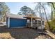 Exterior shot of the home showing the fenced backyard and covered porch at 1981 Lindsey Ln, Decatur, GA 30035