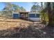 The house has a large backyard and covered porch at 1981 Lindsey Ln, Decatur, GA 30035