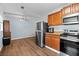 Open-concept kitchen and dining area with stainless steel appliances and ample cabinet space for modern living at 1981 Lindsey Ln, Decatur, GA 30035