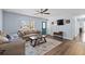 Well-lit living room features hardwood floors, a ceiling fan, and comfortable couches at 1981 Lindsey Ln, Decatur, GA 30035