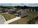 Aerial view of a neighborhood featuring well-maintained homes, lush green lawns, and a community with a Gathering-friendly atmosphere at 200 Baumgard Way, Locust Grove, GA 30248