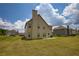 Large backyard with green grass, providing a great space for outdoor entertaining at 200 Baumgard Way, Locust Grove, GA 30248