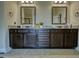 Bathroom vanity with double sinks, granite countertops, and ample storage space at 200 Baumgard Way, Locust Grove, GA 30248