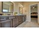 Bathroom featuring double vanities, granite countertops and tile flooring at 200 Baumgard Way, Locust Grove, GA 30248