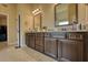Bathroom featuring double vanities, granite countertops and tile flooring at 200 Baumgard Way, Locust Grove, GA 30248