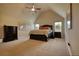 Spacious bedroom with a vaulted ceiling, plush carpet, and large windows at 200 Baumgard Way, Locust Grove, GA 30248