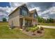 Well-maintained home featuring a brick and siding exterior, attached garage, and landscaped front yard at 200 Baumgard Way, Locust Grove, GA 30248