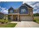 Inviting home with a well-manicured lawn and a two-car garage, great curb appeal at 200 Baumgard Way, Locust Grove, GA 30248
