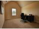 Home office space with vaulted ceilings and neutral carpet at 200 Baumgard Way, Locust Grove, GA 30248