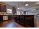 Modern kitchen with stainless steel appliances, a center island, and dark wood cabinetry at 200 Baumgard Way, Locust Grove, GA 30248