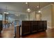 Open-concept kitchen with a center island and views of the dining area and living room at 200 Baumgard Way, Locust Grove, GA 30248