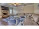 Inviting living room with coffered ceilings, a cozy fireplace, comfortable seating, and a stylish blue rug at 200 Baumgard Way, Locust Grove, GA 30248