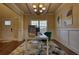 Home office with a modern desk, comfortable chair, and bright natural light at 200 Baumgard Way, Locust Grove, GA 30248