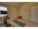Workout room featuring natural light, neutral colored walls, and exercise equipment at 200 Baumgard Way, Locust Grove, GA 30248