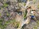 Aerial view showing an area with a large lot, mature trees and a sparkling blue pool at 2570 Curtis Sw Rd, Marietta, GA 30064