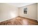 Comfortable bedroom with hardwood flooring and window bringing in lots of natural light at 2570 Curtis Sw Rd, Marietta, GA 30064