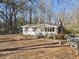 Charming single-story home with manicured front yard and inviting entryway at 2570 Curtis Sw Rd, Marietta, GA 30064