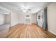 Spacious living room with hardwood floors, fireplace, and a ceiling fan at 2570 Curtis Sw Rd, Marietta, GA 30064