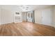 Bright living room featuring hardwood floors, a fireplace, and natural light from a large window at 2570 Curtis Sw Rd, Marietta, GA 30064