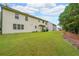 A large backyard with green grass perfect for outdoor activities and gatherings at 4007 Fellowship Dr, Buford, GA 30519