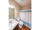 Bathroom featuring a vanity, toilet, and a shower with a curtain at 4007 Fellowship Dr, Buford, GA 30519