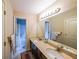 Bathroom with double sinks, tile flooring, and doorway to shower/tub at 4007 Fellowship Dr, Buford, GA 30519
