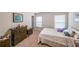 Comfortable bedroom with neutral colors, light brown carpet, and plush pillows on a cozy bed at 4007 Fellowship Dr, Buford, GA 30519