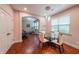 Charming dining area adjacent to an exercise room with a treadmill and comfortable seating at 4007 Fellowship Dr, Buford, GA 30519