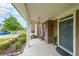 Inviting covered front porch with brick accents and well-maintained landscaping at 4007 Fellowship Dr, Buford, GA 30519