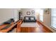 Bright home office with hardwood floors, a desk, and a comfortable seating area at 4007 Fellowship Dr, Buford, GA 30519